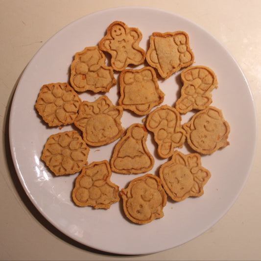 Assorted animal-shaped cookies on a white plate