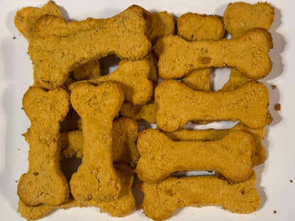 bone shaped sweet potato natural dog treats on a white plate