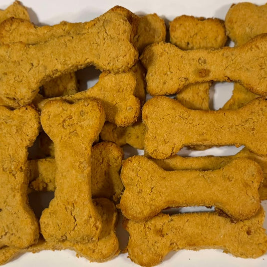 bone shaped sweet potato natural dog treats on a white plate