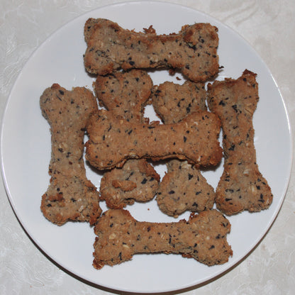 bone shaped blueberry natural dog treats on a white plate
