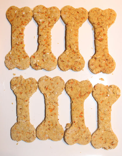 Bone-shaped dog cookies arranged in two rows on a white background